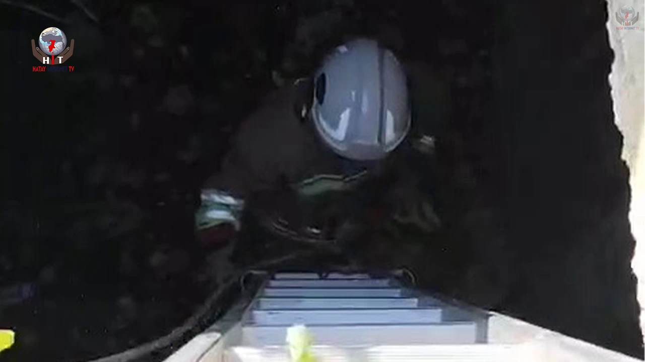 Atık su deposuna düşen kediyi kurtaran itfaiyeci, alkışlarla karşılandı