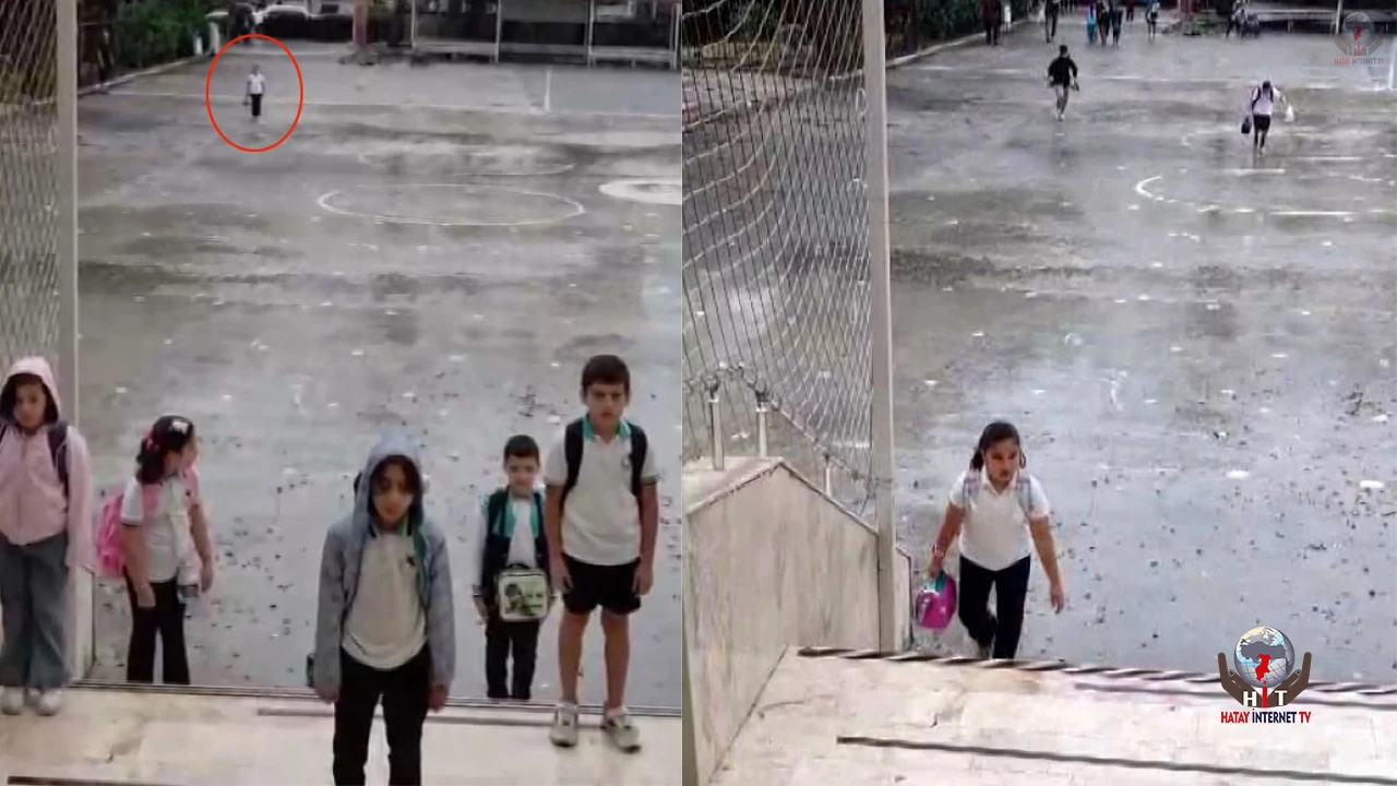 Yağmur altında istiklal marşı okuyan ilkokul öğrencisi takdir topladı