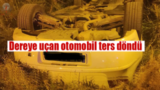 Dereye uçan otomobil ters döndü