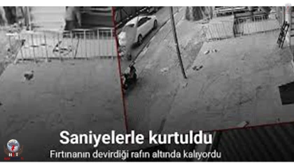 Fırtınanın devirdiği rafın altında kalmaktan saniyelerle kurtulan çocuğun o anları kamerada