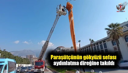 Paraşütçünün gökyüzü sefası aydınlatma direğine takıldı