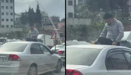 Canını hiçe sayarak otomobilin üzerinde alkol tüketen şahsın keyfi pes dedirtti