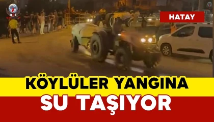 Köylüler yangın bölgesine traktörlerle su taşıdı