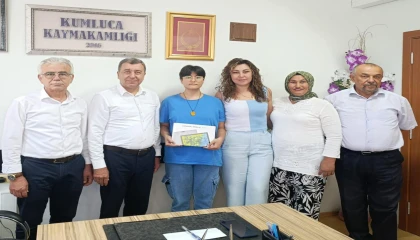 Kumlucada YKSde ilk bine giren üç öğrenciye ödül