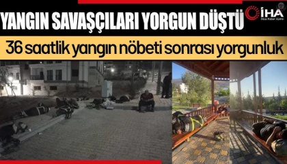 Saatler süren yangında yorgun düşen ‘Yangın Savaşçıları yerde uyuyarak dinlendiler