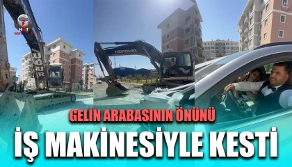 İş makinesiyle gelin arabasının önünü kesen operatör, bahşiş alınca yolu açtı