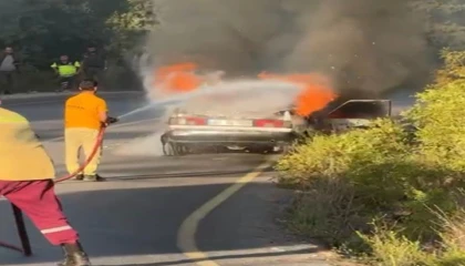Osmaniyede otomobil yangını ormana sıçramadan söndürüldü