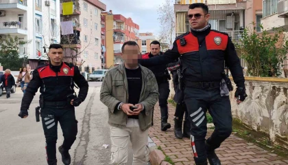 Apartman bahçesine sakladığı pompalı tüfek polisi alarma geçirdi