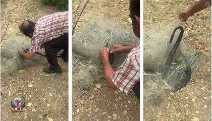 Balık ağında mahsur kılan yılanı elleriyle kurtardı