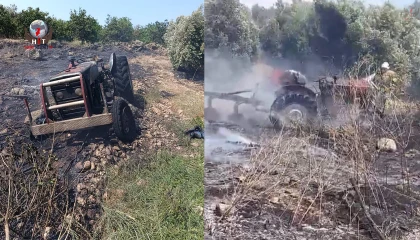 Erzinde otluk alanda çıkan yangında alevler traktöre sıçradı