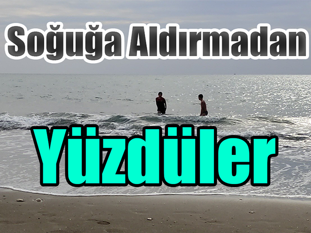 Hatayda Soğuğa aldırmadan sahilde yüzdüler